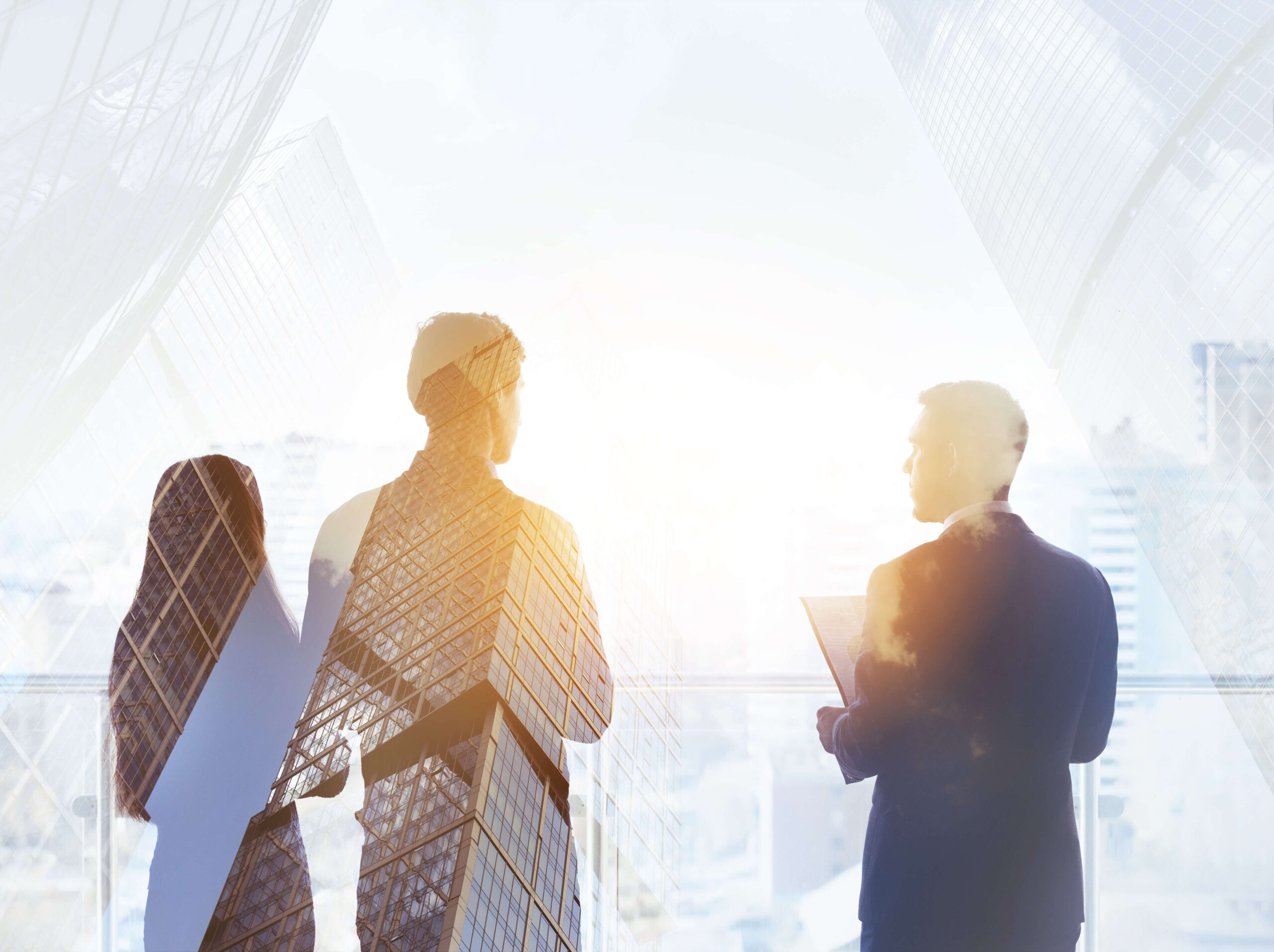 Three people talking with reflection of skyscrapers overlaid.