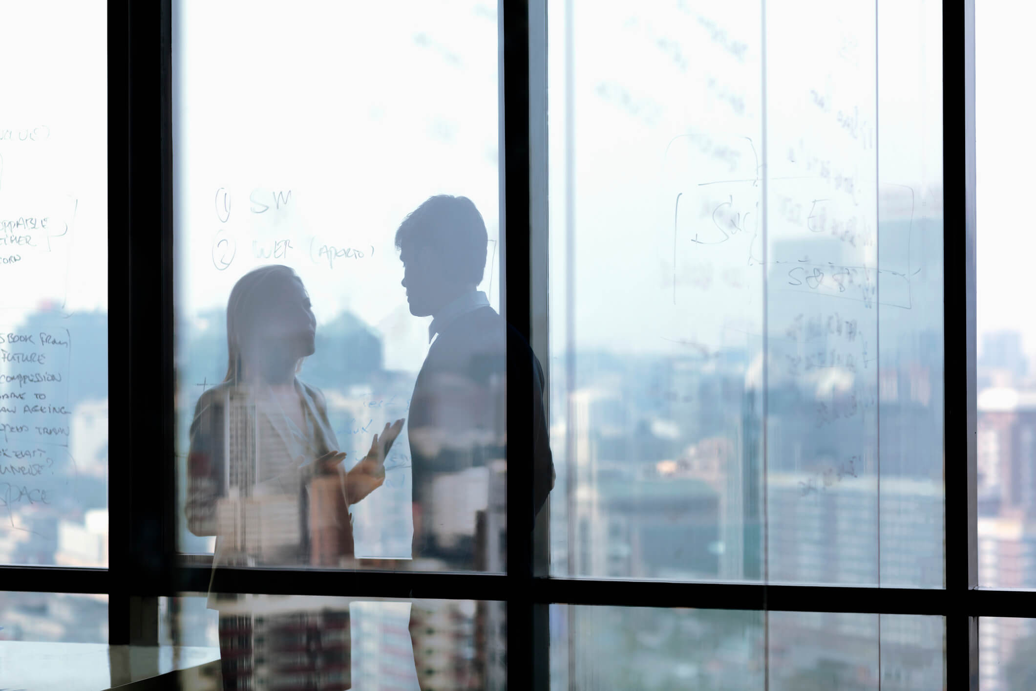 Silhouette shadows of business people talking in office